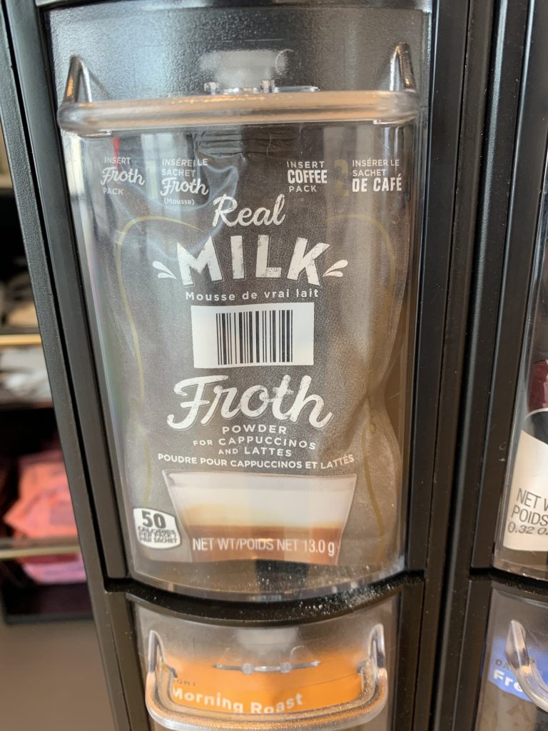 A closeup of a Lavazza “milk foam powder” pack for their super auto espresso machines.